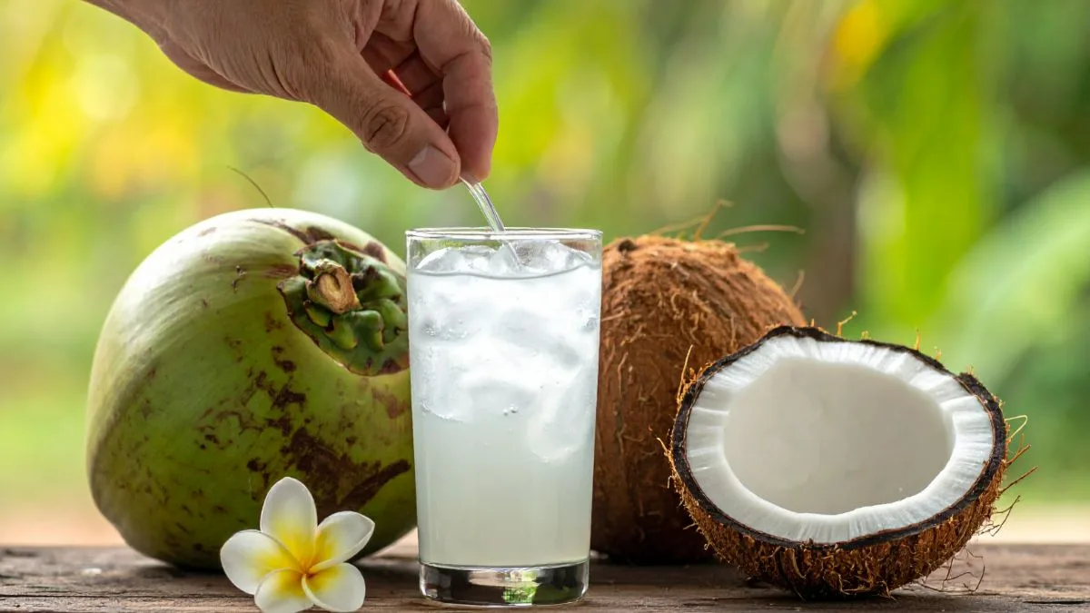 Fresh coconuts and a glass of coconut water